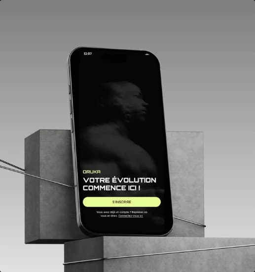 Oruka sign-up screen on a phone resting on concrete blocks