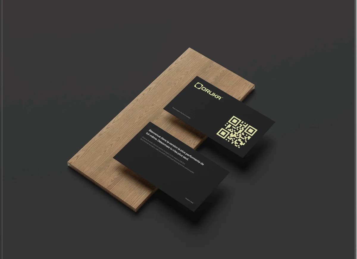 Oruka business cards on a wooden stand